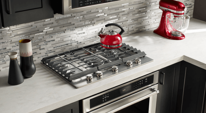 A modern kitchen with a gas cooktop A modern kitchen with a gas cooktop