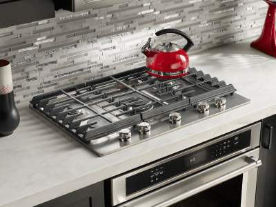 A modern kitchen with a gas cooktop A modern kitchen with a gas cooktop