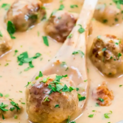 Swedish meatball on wooden spoon