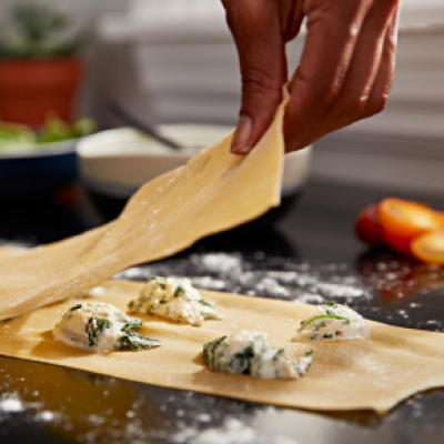 Close up of person making ravioli