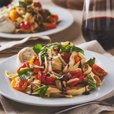 Homemade fettuccine with tomatoes and fresh herbs