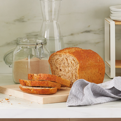 Sliced banana bread on top of wood cutting board