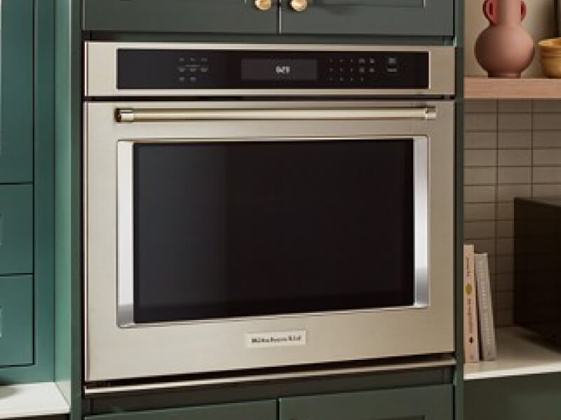 KitchenAid® wall oven in blue-green cabinetry