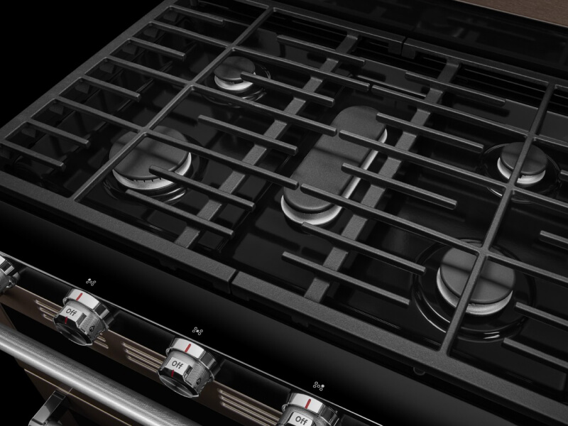 Close-up of a gas cooktop with steel grates