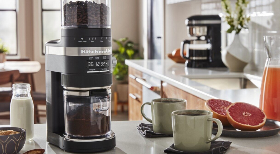 KitchenAid® coffee grinder and two cups of coffee  KitchenAid® coffee grinder and two cups of coffee