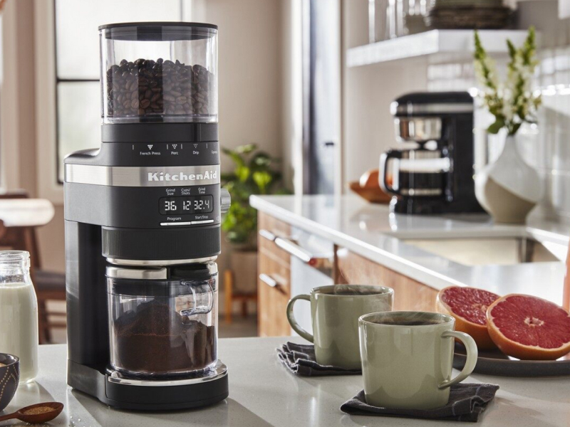 KitchenAid® coffee grinder and two cups of coffee  KitchenAid® coffee grinder and two cups of coffee