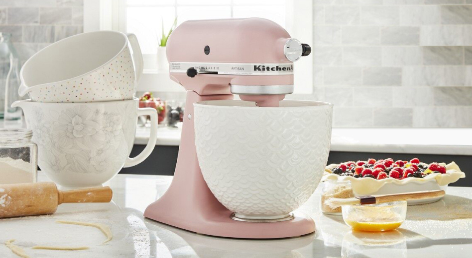 A KitchenAid® mixer working in a mixer bowl