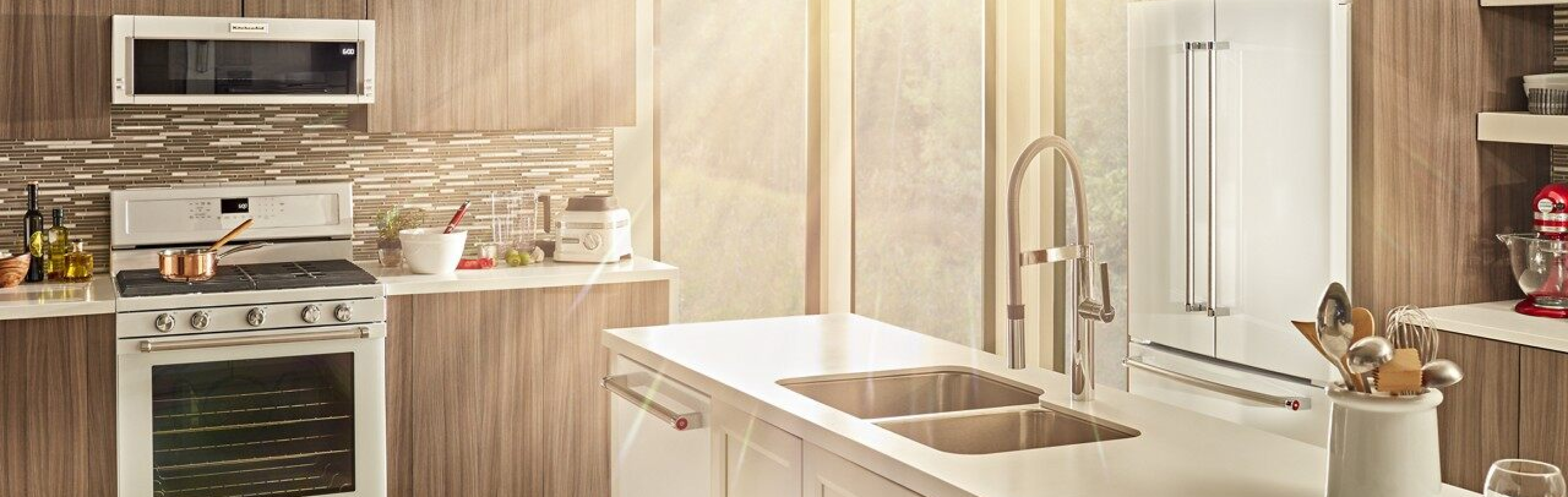 White KitchenAid® appliances in a bright and neutral kitchen