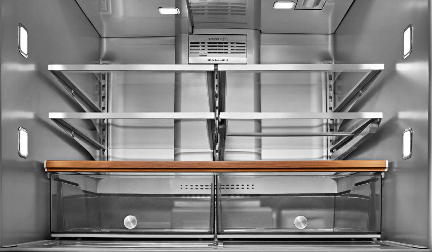 The inside of a well-lit KitchenAid® refrigerator  The inside of a well-lit KitchenAid® refrigerator