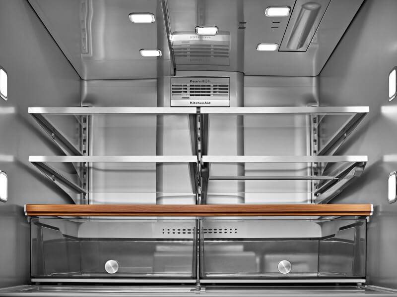 The inside of a well-lit KitchenAid® refrigerator  The inside of a well-lit KitchenAid® refrigerator