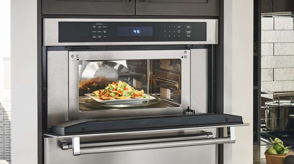 Nachos inside a stainless steel built-in microwave Nachos inside a stainless steel built-in microwave
