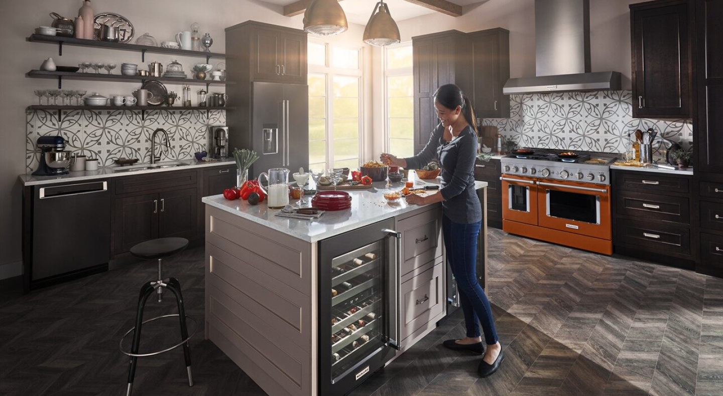 Person cooking in a black themed kitchen