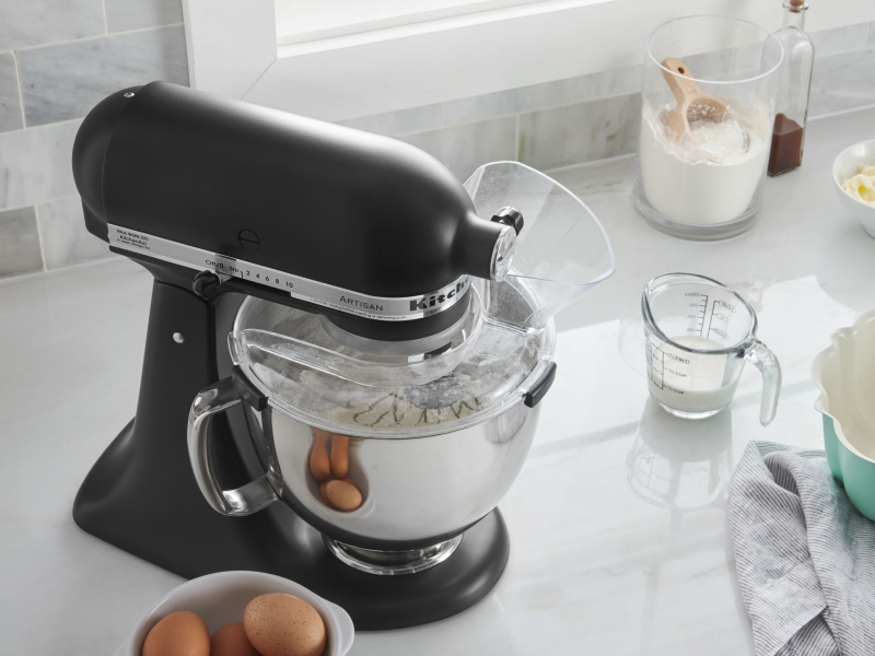 KitchenAid® stand mixer and baking ingredients in bowl with pouring shield