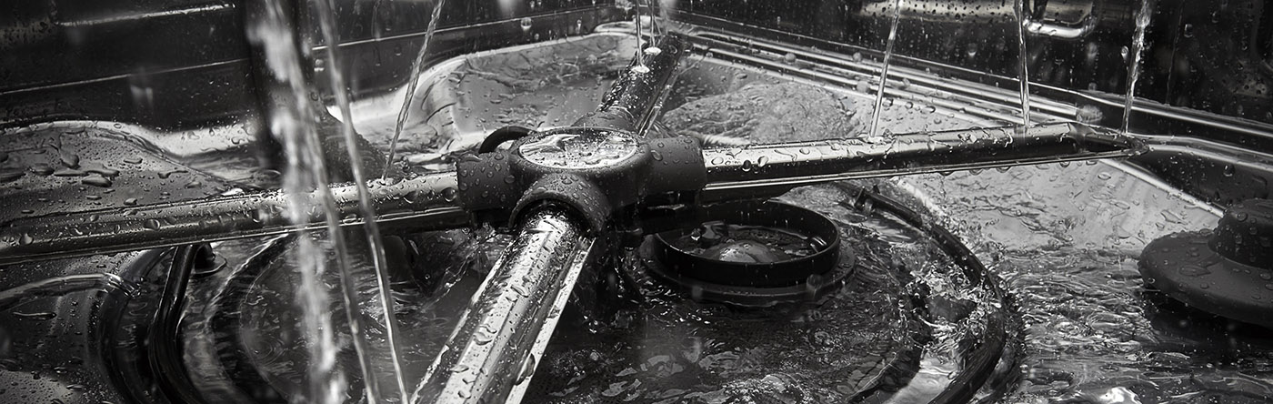 Closeup image of a dishwasher spray arm and filter