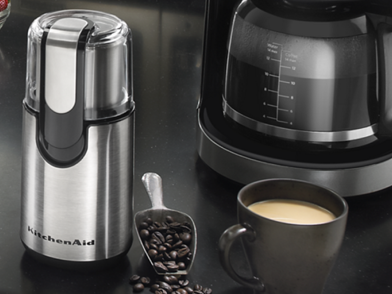 A KitchenAid® blade coffee grinder in a modern kitchen setting A KitchenAid® blade coffee grinder in a modern kitchen setting