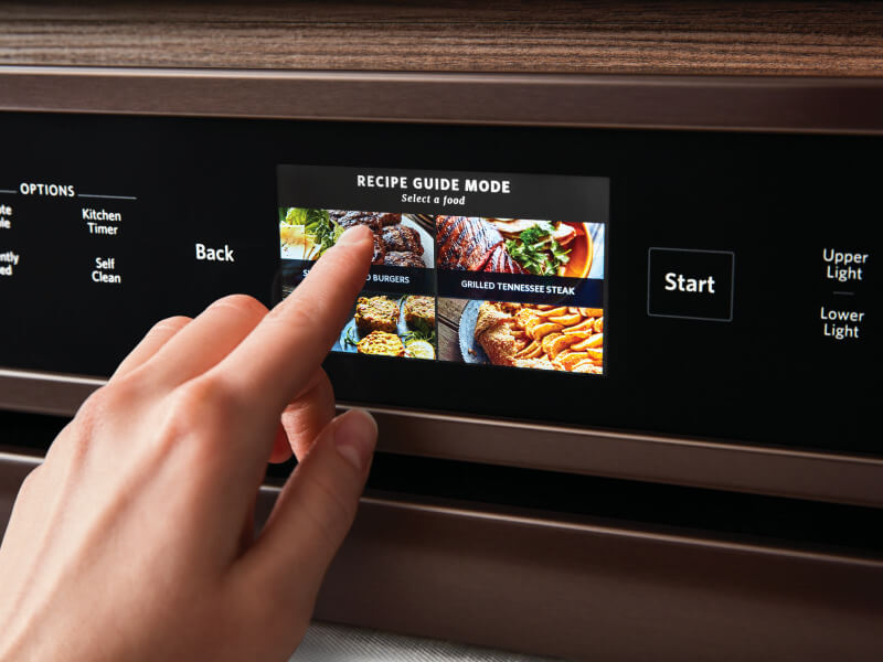 A person selecting a recipe guide mode for a convection bake setting