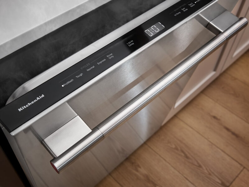 A dishwasher door slightly open