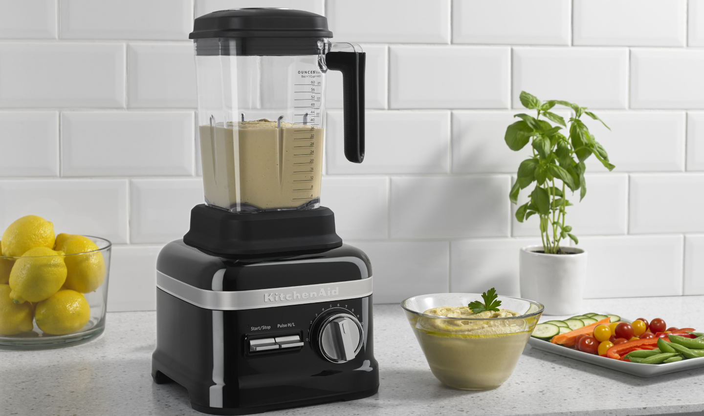 A KitchenAid® blender blending homemade hummus A KitchenAid® blender blending homemade hummus