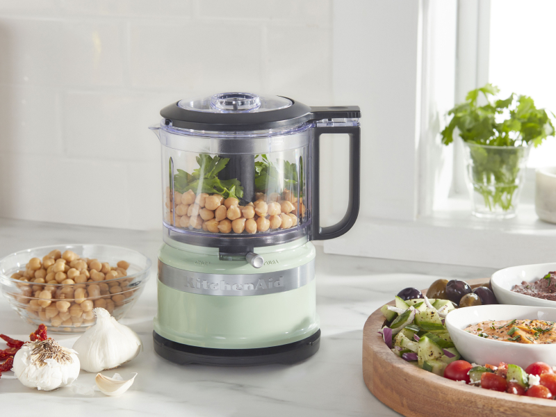 Chickpeas inside a mint green KitchenAid® food processor Chickpeas inside a mint green KitchenAid® food processor