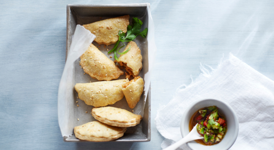 Hand pies made with a food processor in a dish with dipping sauce Hand pies made with a food processor in a dish with dipping sauce