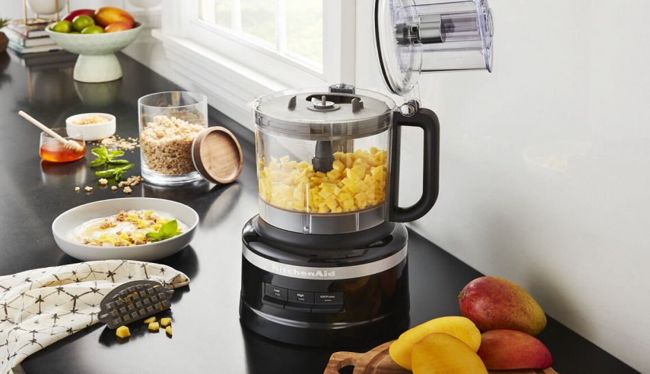 Black KitchenAid® food processor with mango in work bowl  Black KitchenAid® food processor with mango in work bowl