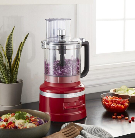 A KitchenAid® food processor chopping onions. A KitchenAid® food processor chopping onions.