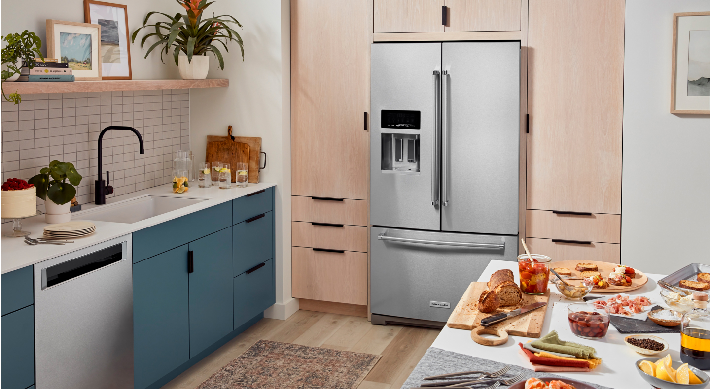 Stainless steel KitchenAid® French door refrigerator and KitchenAid® dishwasher with a pocket handle