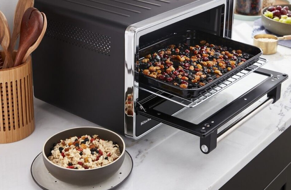 KitchenAid® countertop oven with air fryer filled with dried fruit KitchenAid® countertop oven with air fryer filled with dried fruit