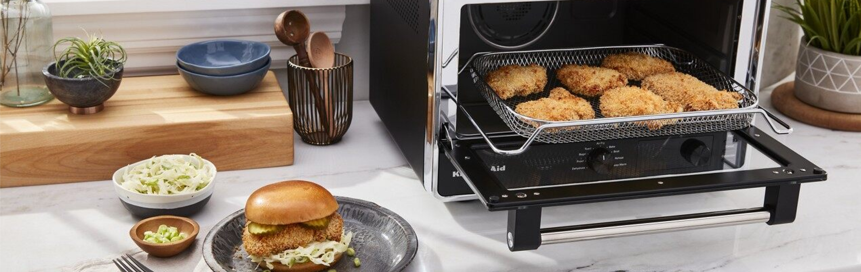 Countertop with KitchenAid® countertop oven with various fried foods