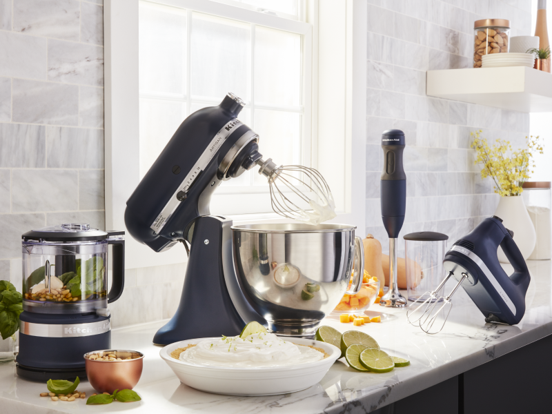 Black KitchenAid® food processor, stand mixer, hand mixer and immersion blender on countertop with key lime pie and ingredients Black KitchenAid® food processor, stand mixer, hand mixer and immersion blender on countertop with key lime pie and ingredients