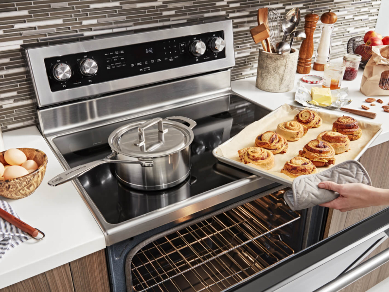 A sheet of cinnamon buns fresh from the oven A sheet of cinnamon buns fresh from the oven