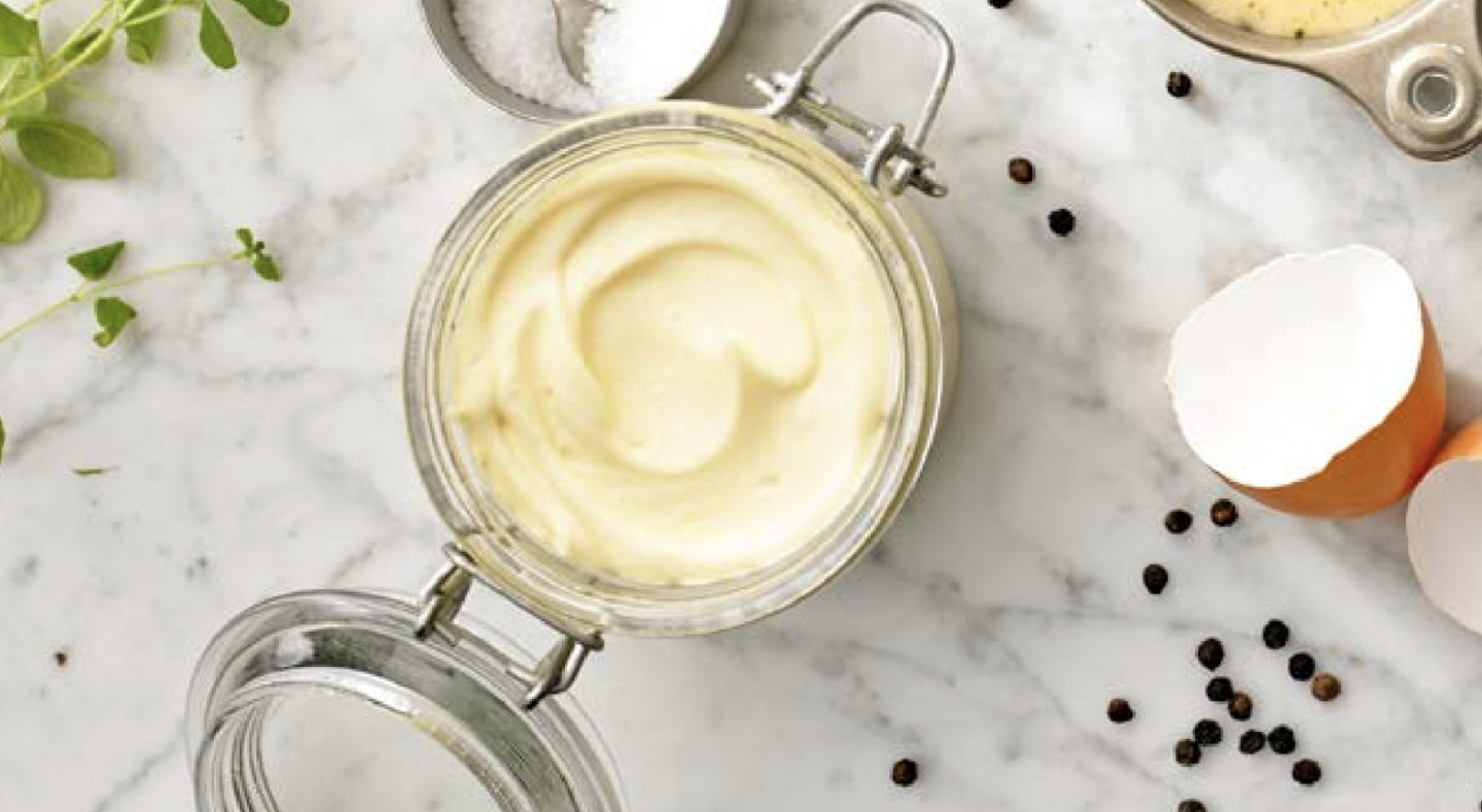 An open jar of mayo An open jar of mayo