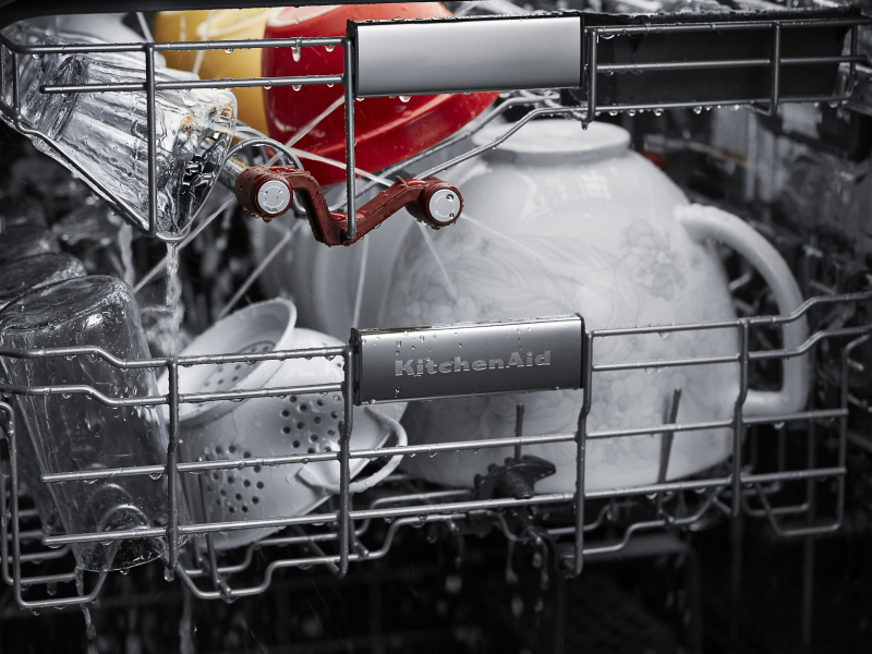 A closeup of the bottom rack of a KitchenAid® dishwasher with dishware. A closeup of the bottom rack of a KitchenAid® dishwasher with dishware.
