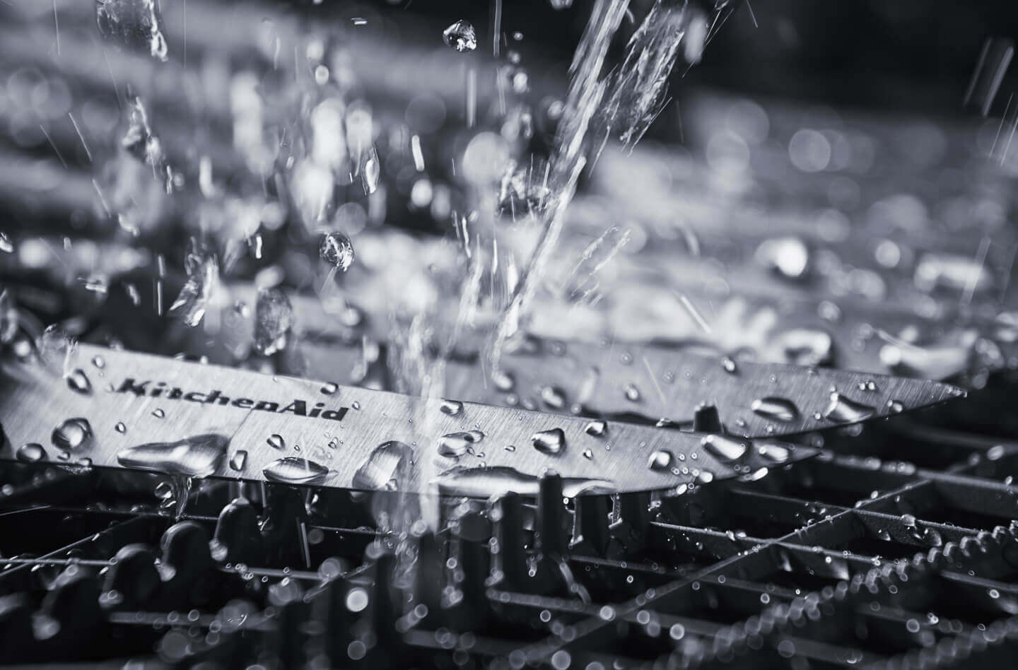 Clean water spraying knives inside of a dishwasher Clean water spraying knives inside of a dishwasher