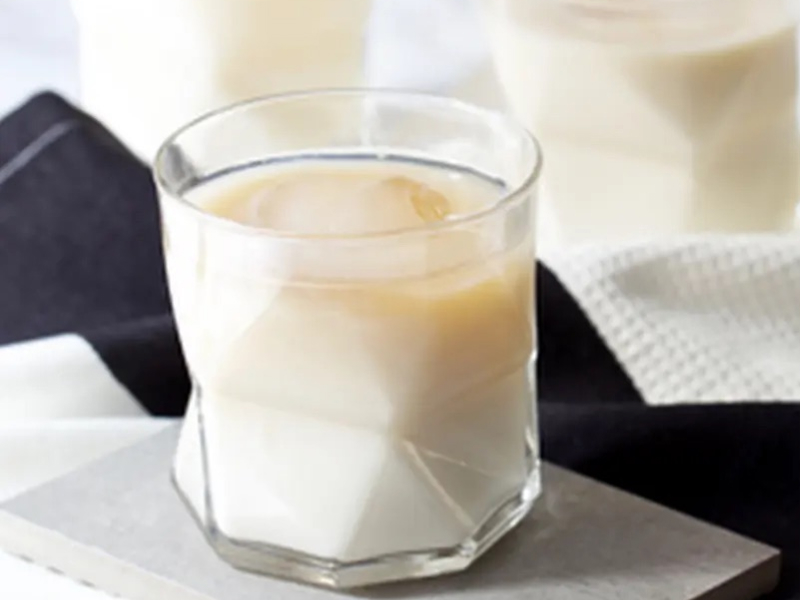 Glass of white tea with milk