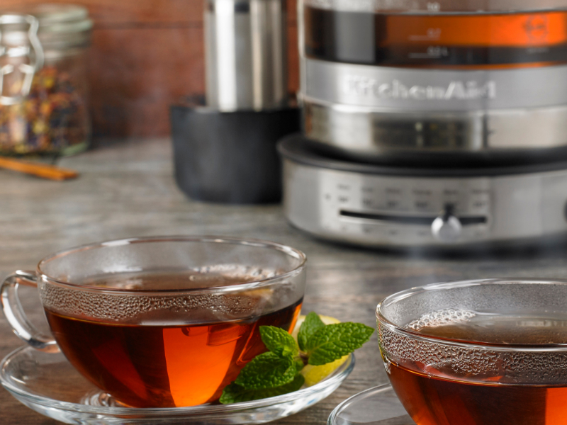 Two glass mugs of herbal tea with mint