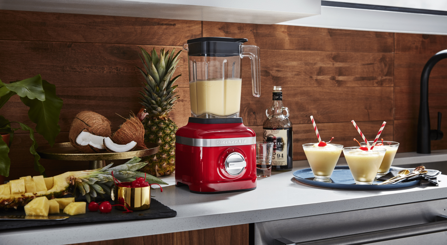 Red KitchenAid® blender filled with smoothie Red KitchenAid® blender filled with smoothie