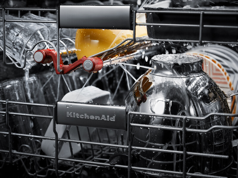 Dishes getting cleaned inside a KitchenAid® dishwasher Dishes getting cleaned inside a KitchenAid® dishwasher