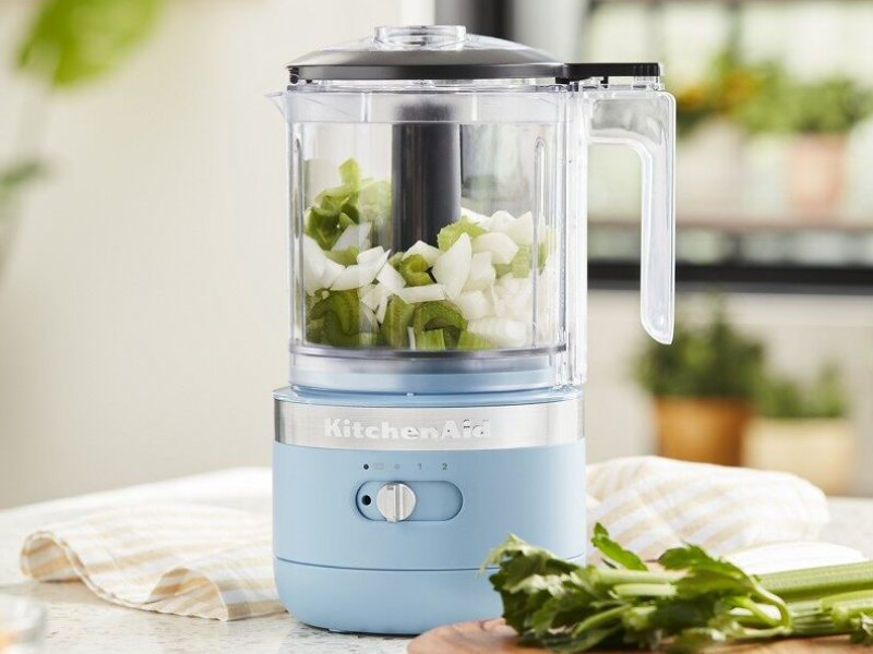 A used KitchenAid® food processor surrounded by various kitchen items A used KitchenAid® food processor surrounded by various kitchen items