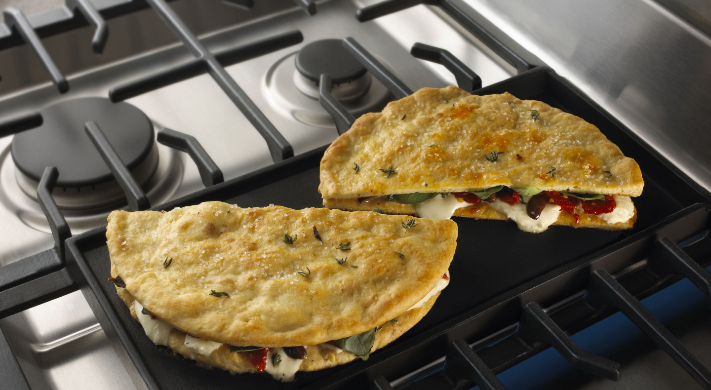 Stuffed pita bread on a griddle Stuffed pita bread on a griddle
