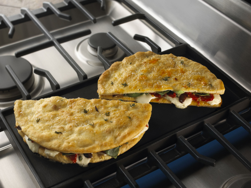 Stuffed pita bread on a griddle Stuffed pita bread on a griddle
