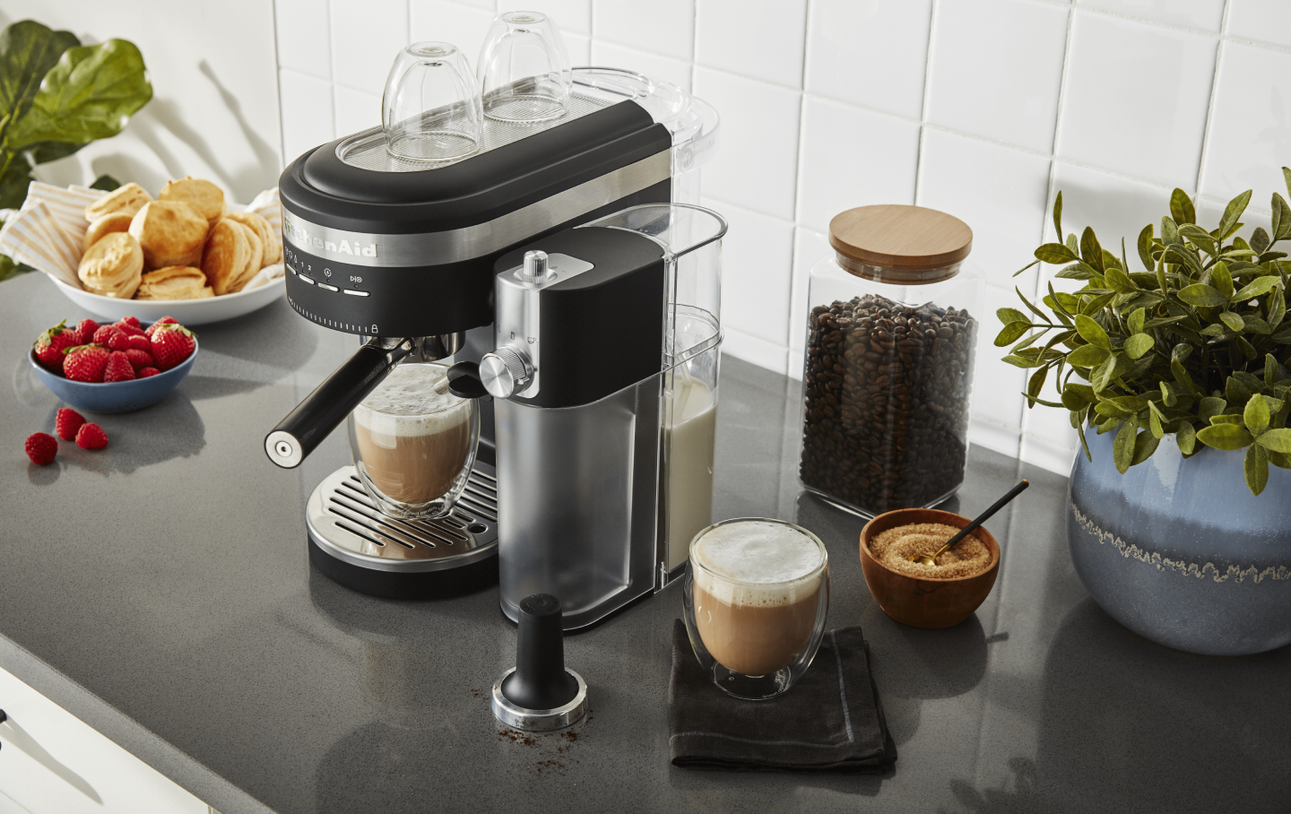 Latte in black KitchenAid® Espresso Machine with Automatic Milk Frother Attachment on counter with ingredients Latte in black KitchenAid® Espresso Machine with Automatic Milk Frother Attachment on counter with ingredients