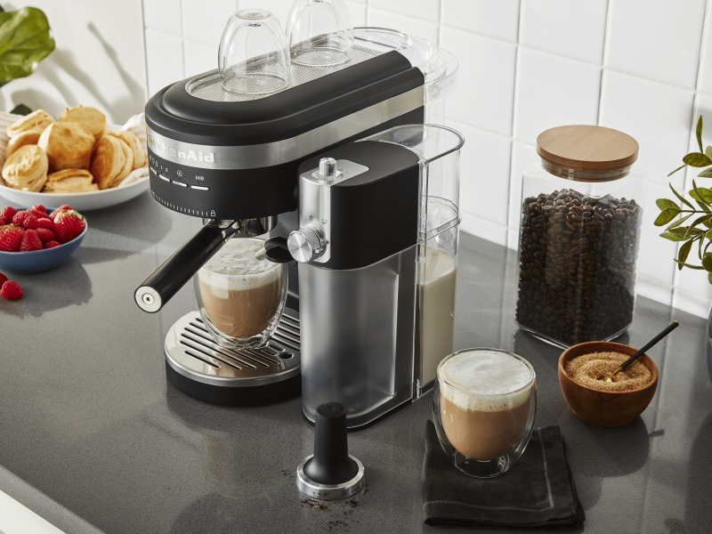 Latte in black KitchenAid® Espresso Machine with Automatic Milk Frother Attachment on counter with ingredients Latte in black KitchenAid® Espresso Machine with Automatic Milk Frother Attachment on counter with ingredients