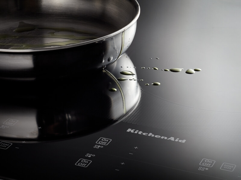 KitchenAid® stovetop with splatter of oil KitchenAid® stovetop with splatter of oil