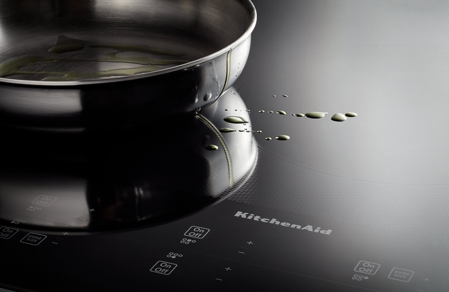 KitchenAid® stovetop with splatter of oil KitchenAid® stovetop with splatter of oil