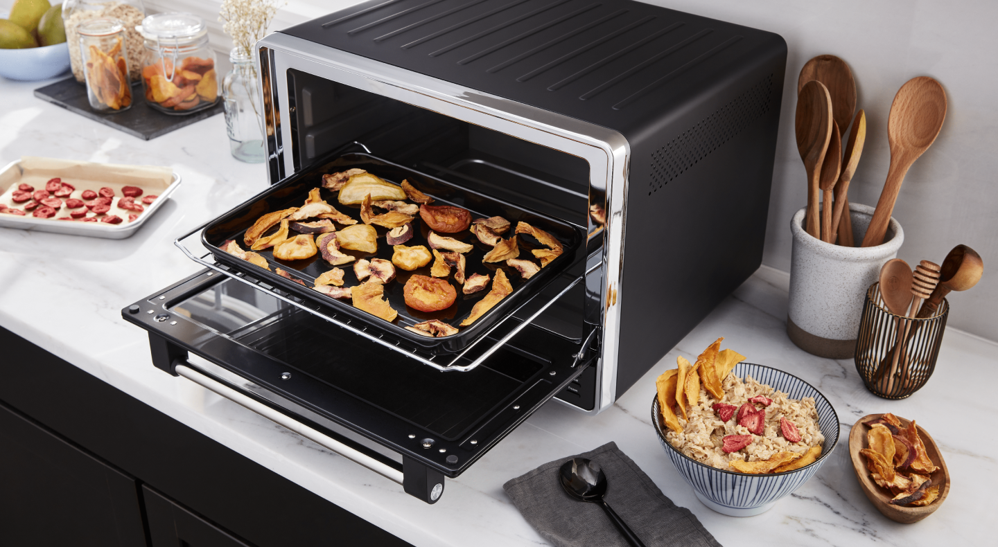 A black KitchenAid® air fryer used to make homemade chips A black KitchenAid® air fryer used to make homemade chips