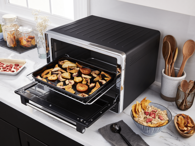 A black KitchenAid® air fryer used to make homemade chips A black KitchenAid® air fryer used to make homemade chips