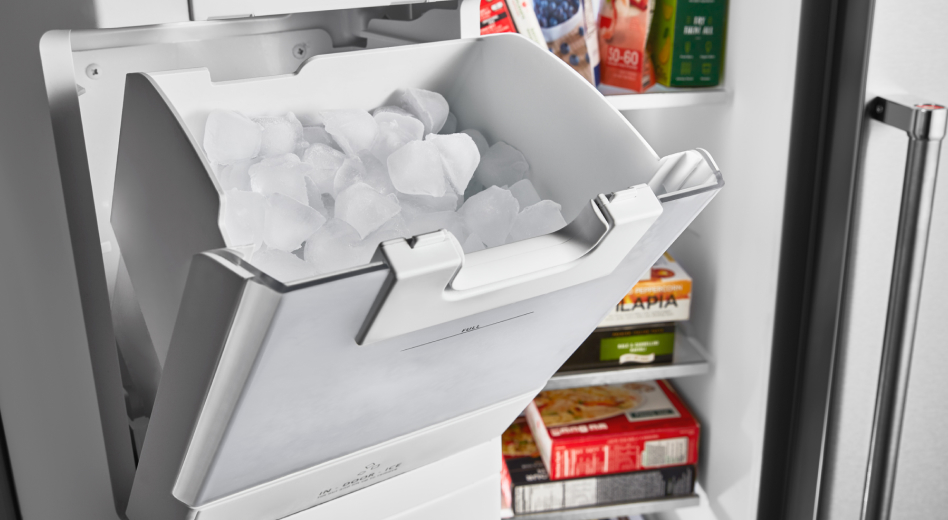 Ice maker with ice in a freezer  Ice maker with ice in a freezer