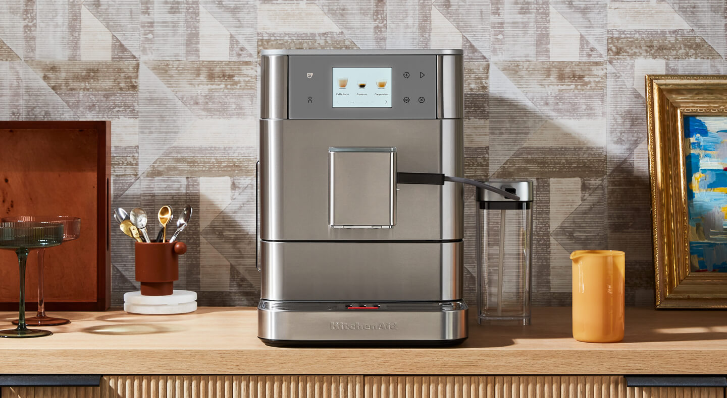 KitchenAid® fully-automatic espresso machine on a coffee bar