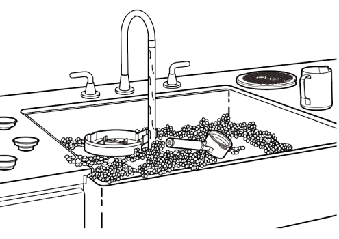 Sink filled with parts of espresso machine soaking in soapy water
